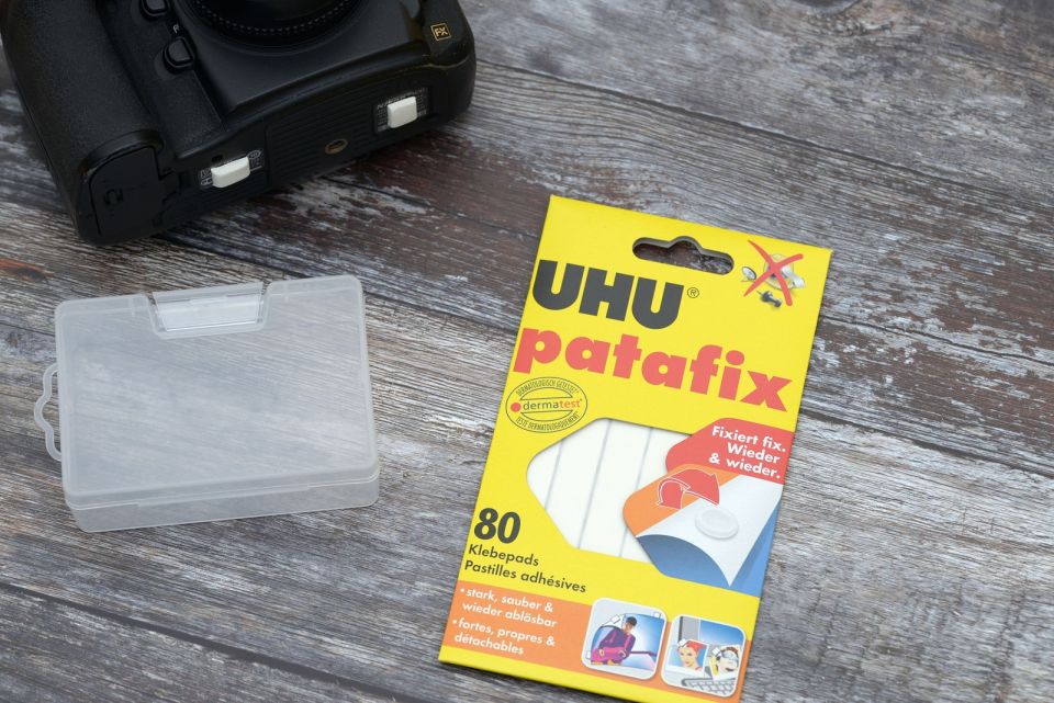 Camera, plastic box, adhesive pads